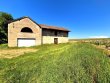 VIGNES-AOP-BROUILLY-AVEC-BATIMENT--ST-LAGER